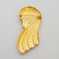 Goudkleurige broche vrouwenhoofd